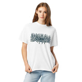 Moose in the winter woods design on a White garment-dyed cotton t-shirt