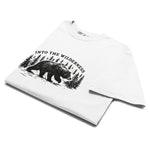 Bear and pine forest wilderness design on a White garment-dyed cotton t-shirt