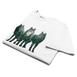 Wolf silhouettes and moonlit forest design on a White garment-dyed cotton t-shirt