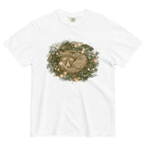 Fox asleep in a Christmas wreath design on a White garment-dyed cotton t-shirt