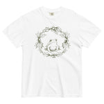 Frog in a holly wreath design on a White garment-dyed cotton t-shirt