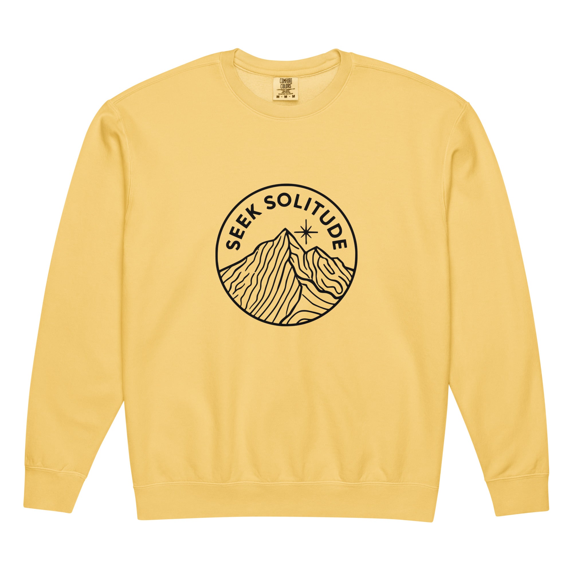 Mountain badge with seek solitude design on a Butter garment-dyed lightweight crewneck sweatshirt