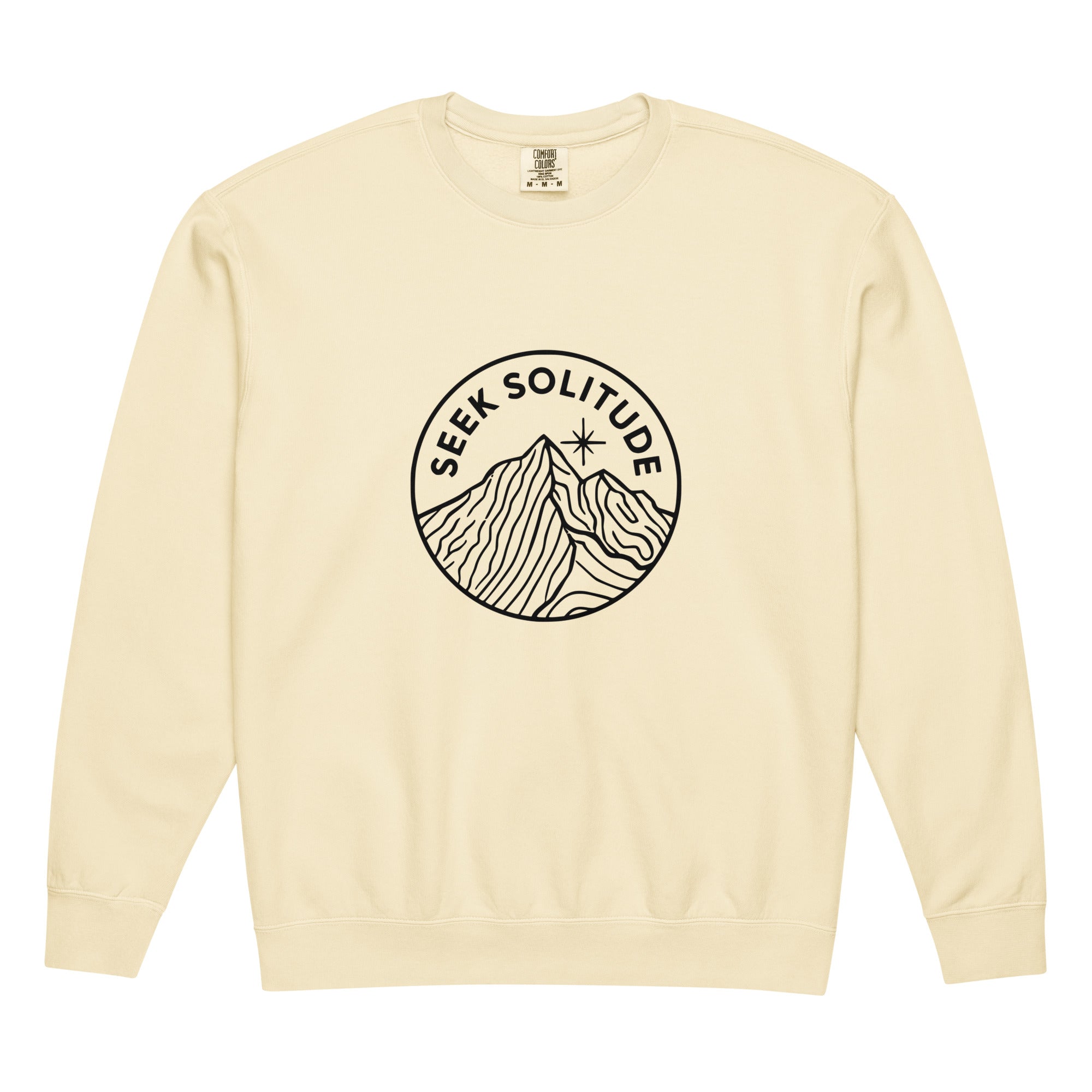 Mountain badge with seek solitude design on an Ivory garment-dyed lightweight crewneck sweatshirt