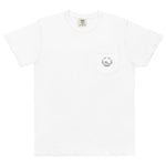 Frog and holly wreath pocket design on a White garment-dyed cotton pocket t-shirt