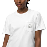 Frog and holly wreath pocket design on a White garment-dyed cotton pocket t-shirt