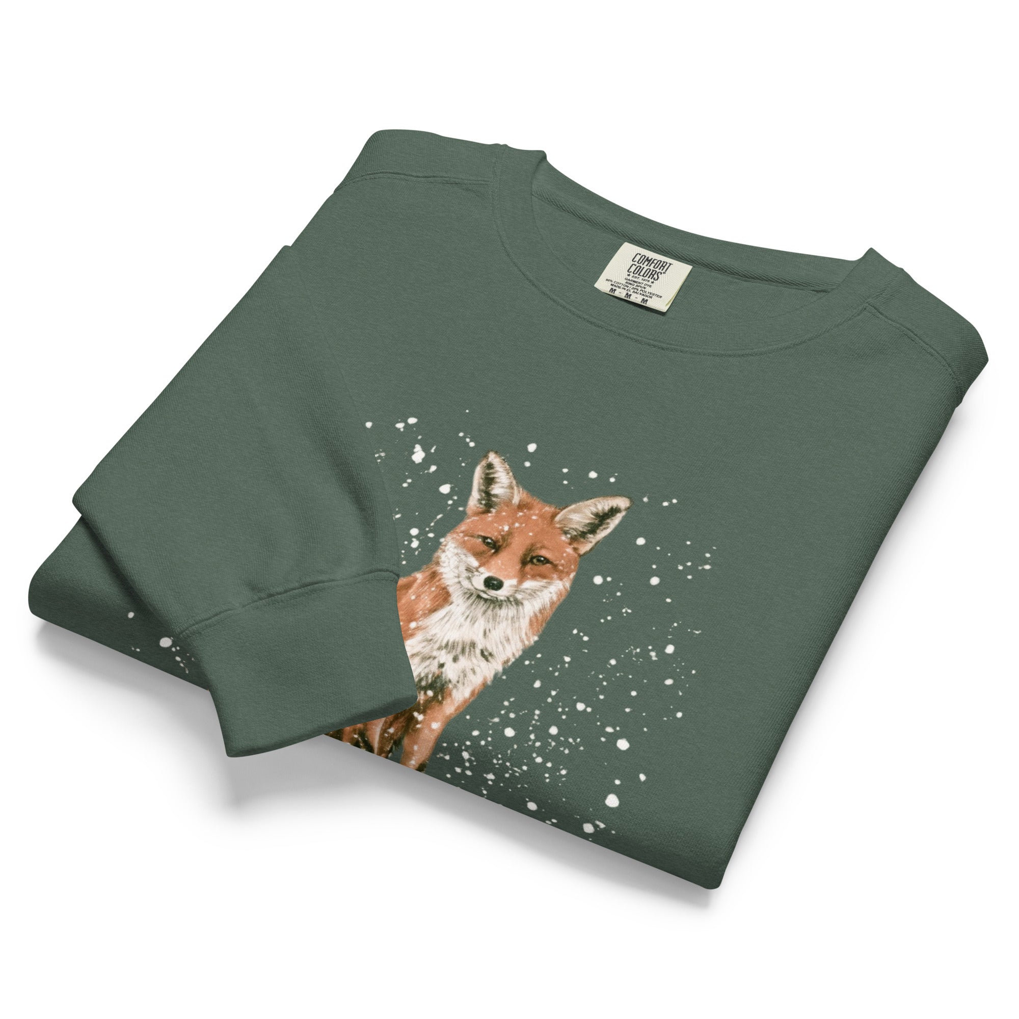 Red fox sitting in the snow design on a Blue Spruce garment-dyed sweatshirt