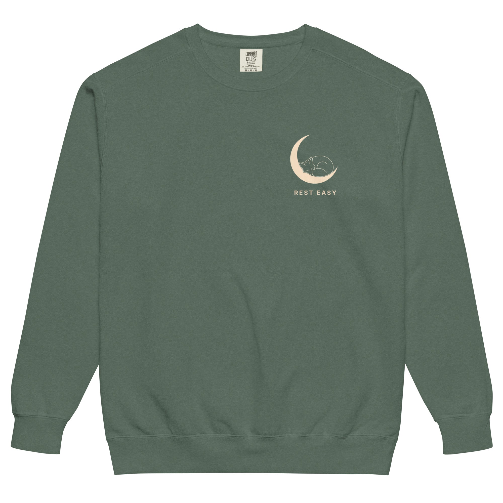 Sleepy fox in a crescent moon design on a Blue Spruce garment-dyed sweatshirt