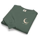 Sleepy fox in a crescent moon design on a Blue Spruce garment-dyed sweatshirt