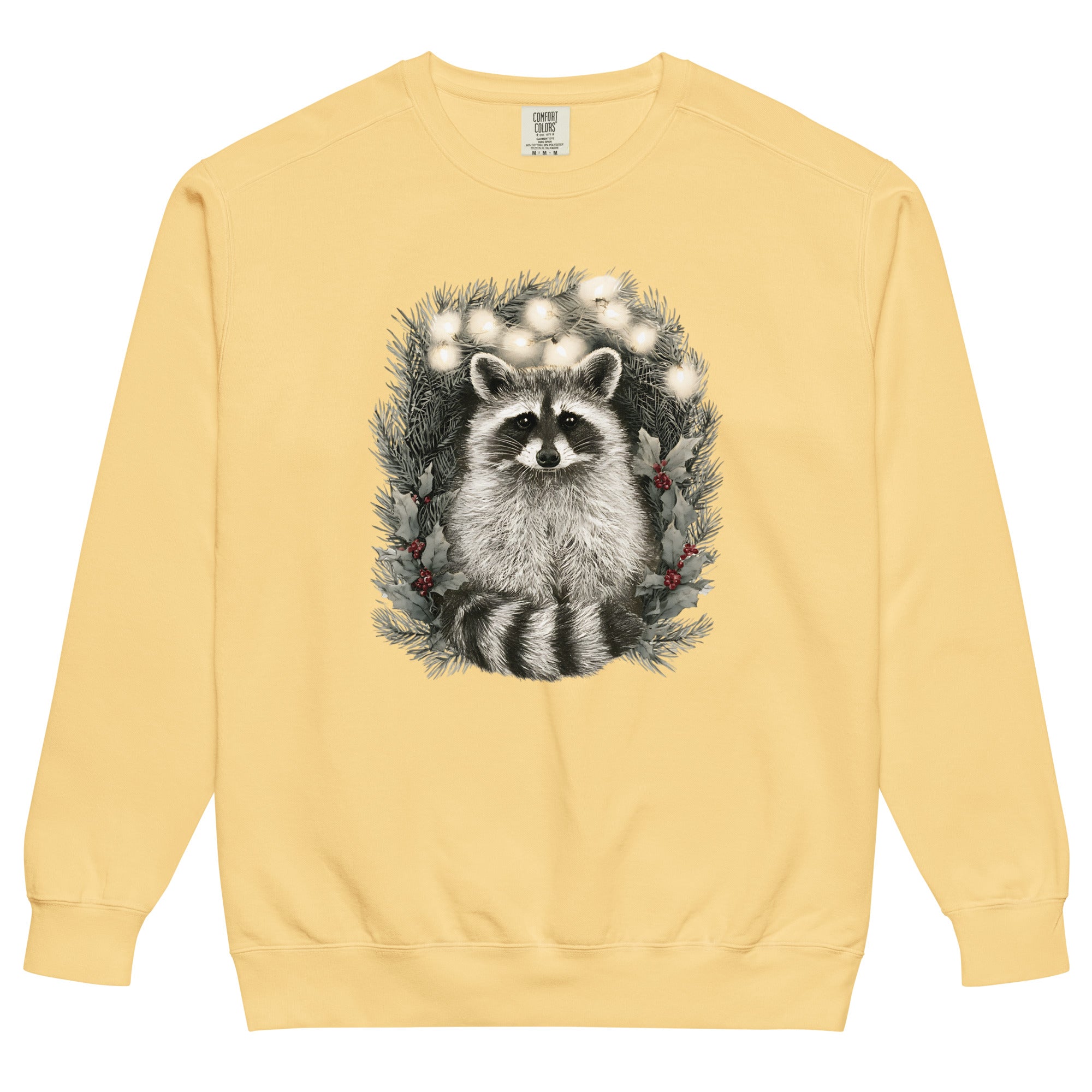 Raccoon in a Christmas wreath design on a Butter garment-dyed sweatshirt