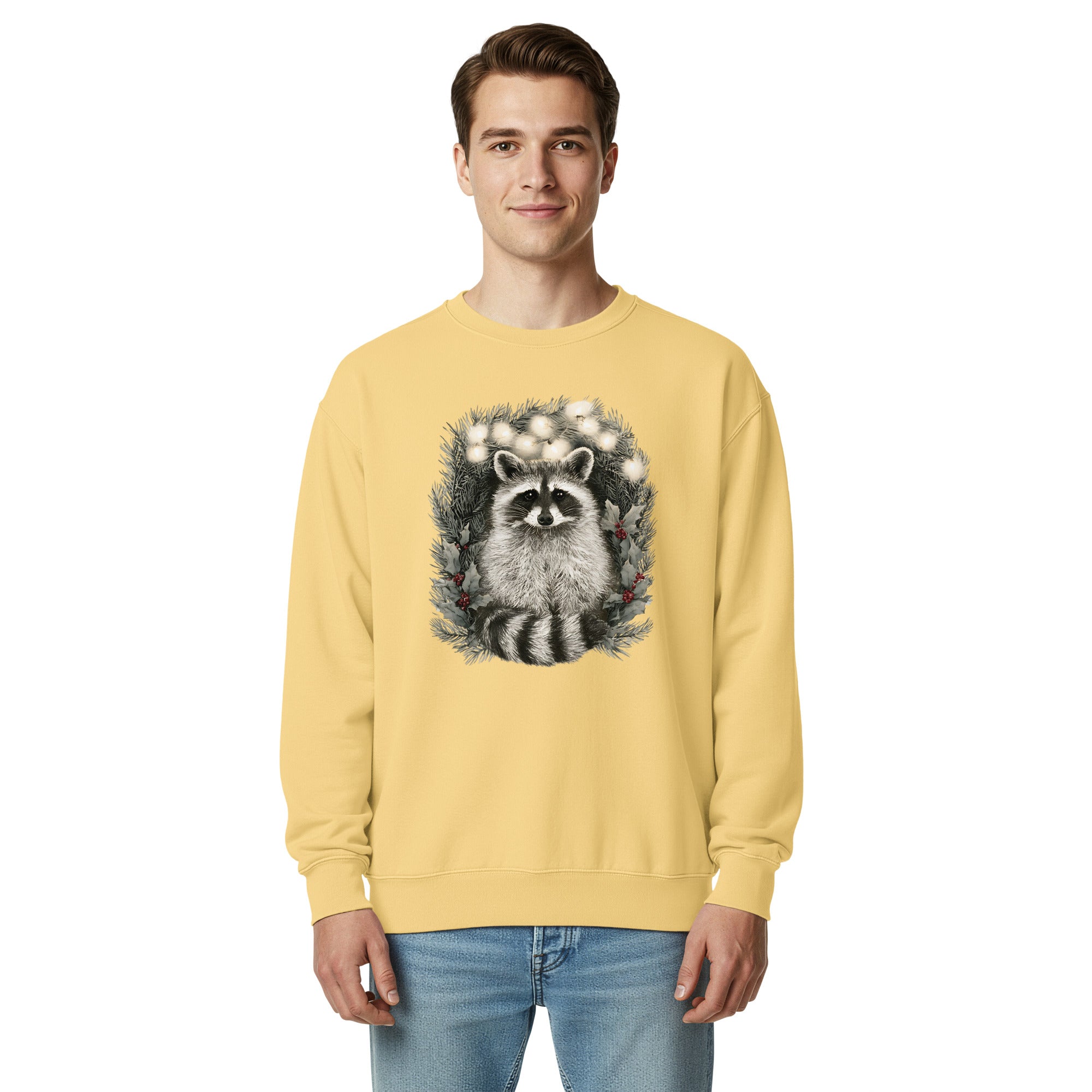 Raccoon in a Christmas wreath design on a Butter garment-dyed sweatshirt