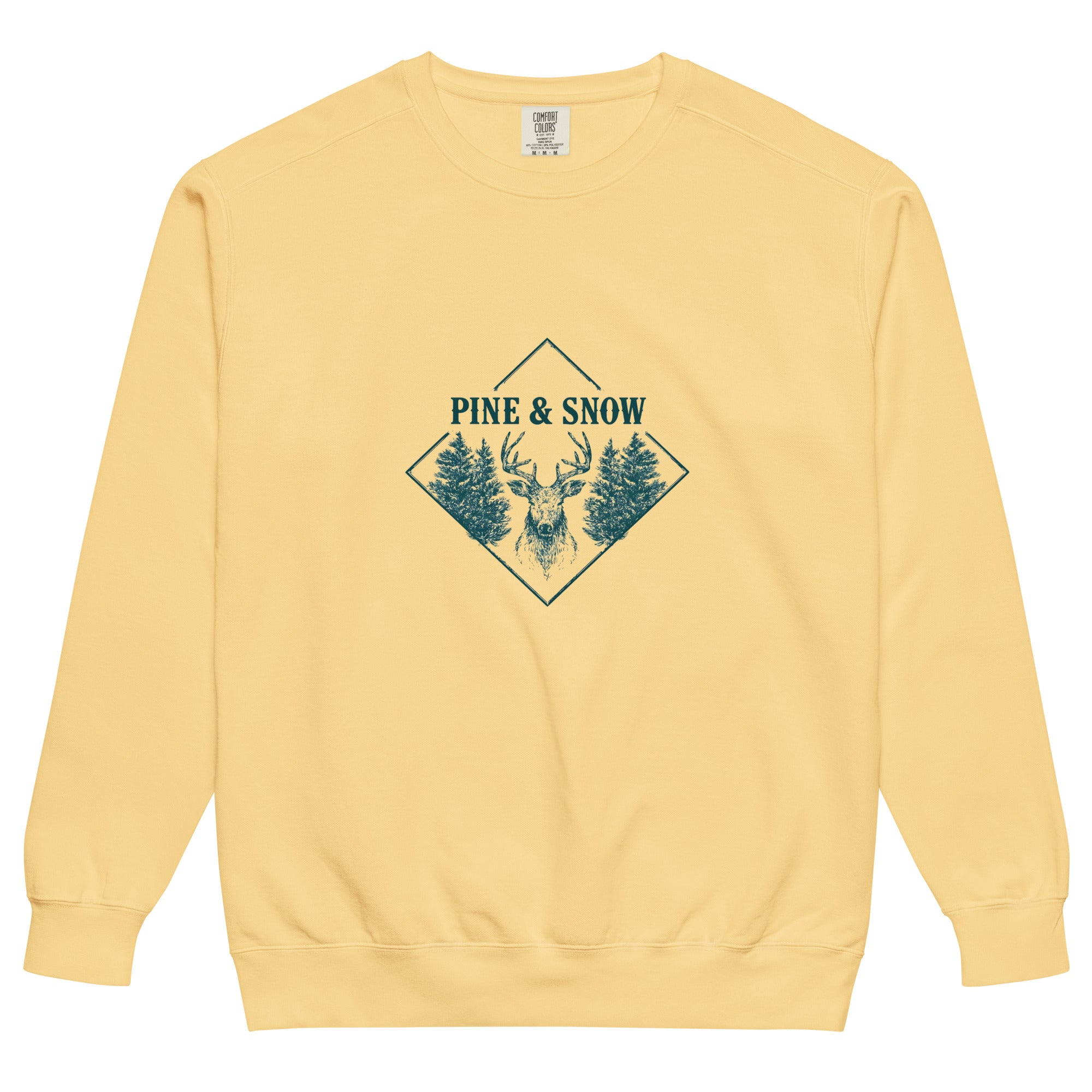 Stag emblem with pine and snow design on a Butter garment-dyed sweatshirt