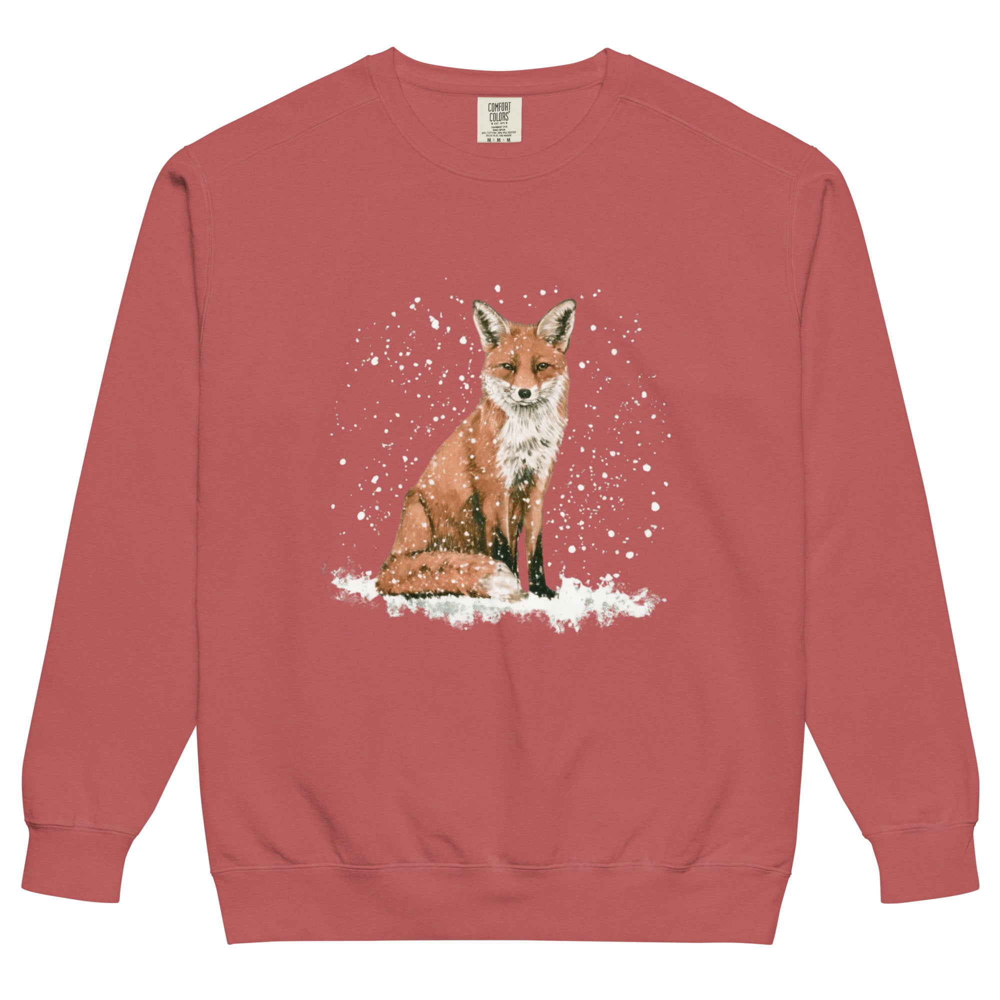 Red fox sitting in the snow design on a Crimson garment-dyed sweatshirt