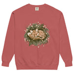 Fox asleep in a Christmas wreath design on a Crimson garment-dyed sweatshirt