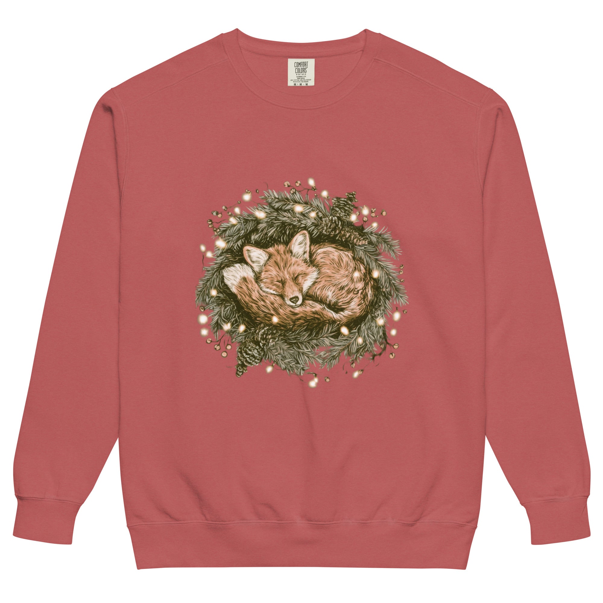 Fox asleep in a Christmas wreath design on a Crimson garment-dyed sweatshirt