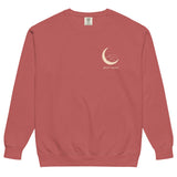 Sleepy fox in a crescent moon design on a Crimson garment-dyed sweatshirt