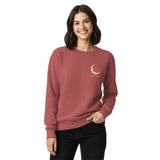 Sleepy fox in a crescent moon design on a Crimson garment-dyed sweatshirt