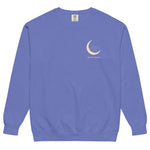 Sleepy fox in a crescent moon design on a Flo Blue garment-dyed sweatshirt
