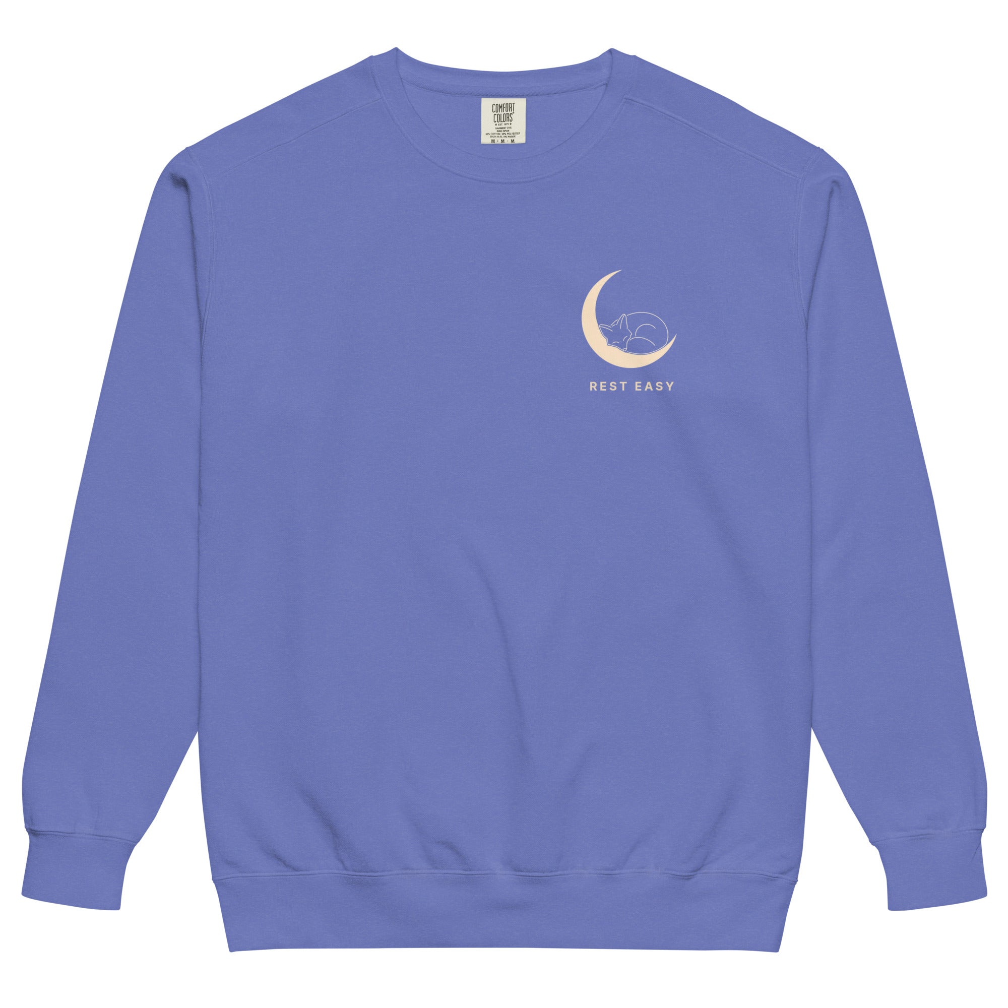 Sleepy fox in a crescent moon design on a Flo Blue garment-dyed sweatshirt