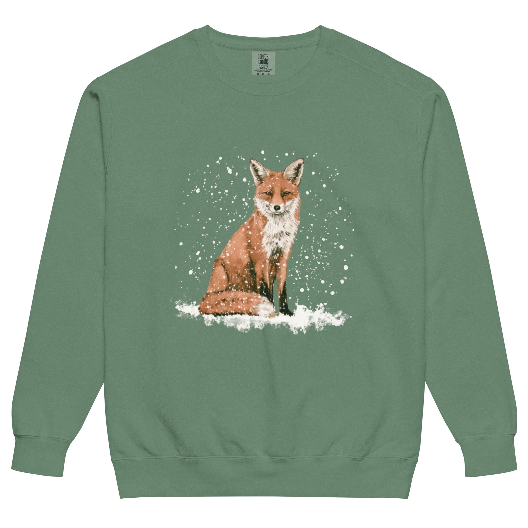 Red fox sitting in the snow design on a Light Green garment-dyed sweatshirt