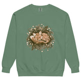 Fox asleep in a Christmas wreath design on a Light Green garment-dyed sweatshirt