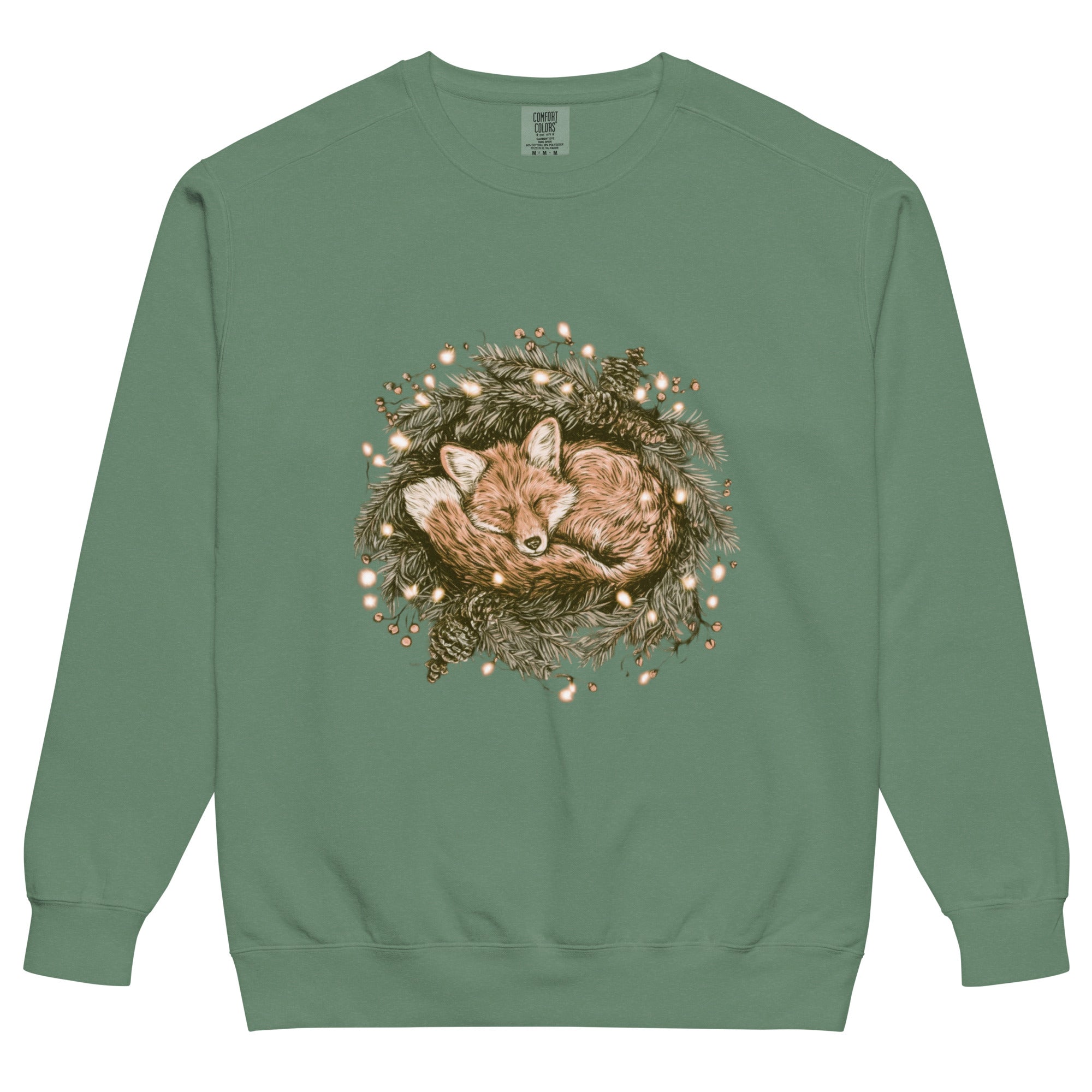 Fox asleep in a Christmas wreath design on a Light Green garment-dyed sweatshirt