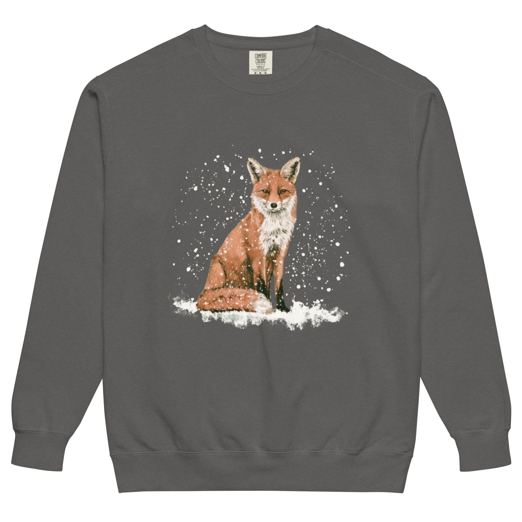 Red fox sitting in the snow design on a Pepper garment-dyed sweatshirt