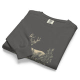 White stag among pine boughs design on a Pepper garment-dyed sweatshirt