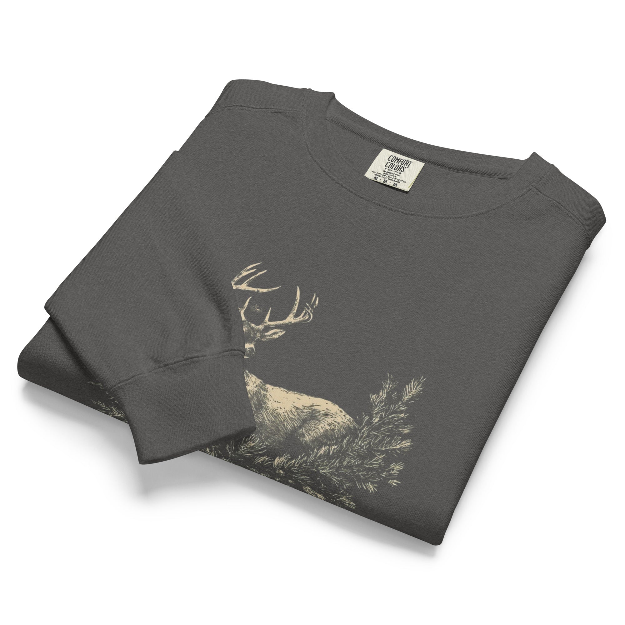 White stag among pine boughs design on a Pepper garment-dyed sweatshirt
