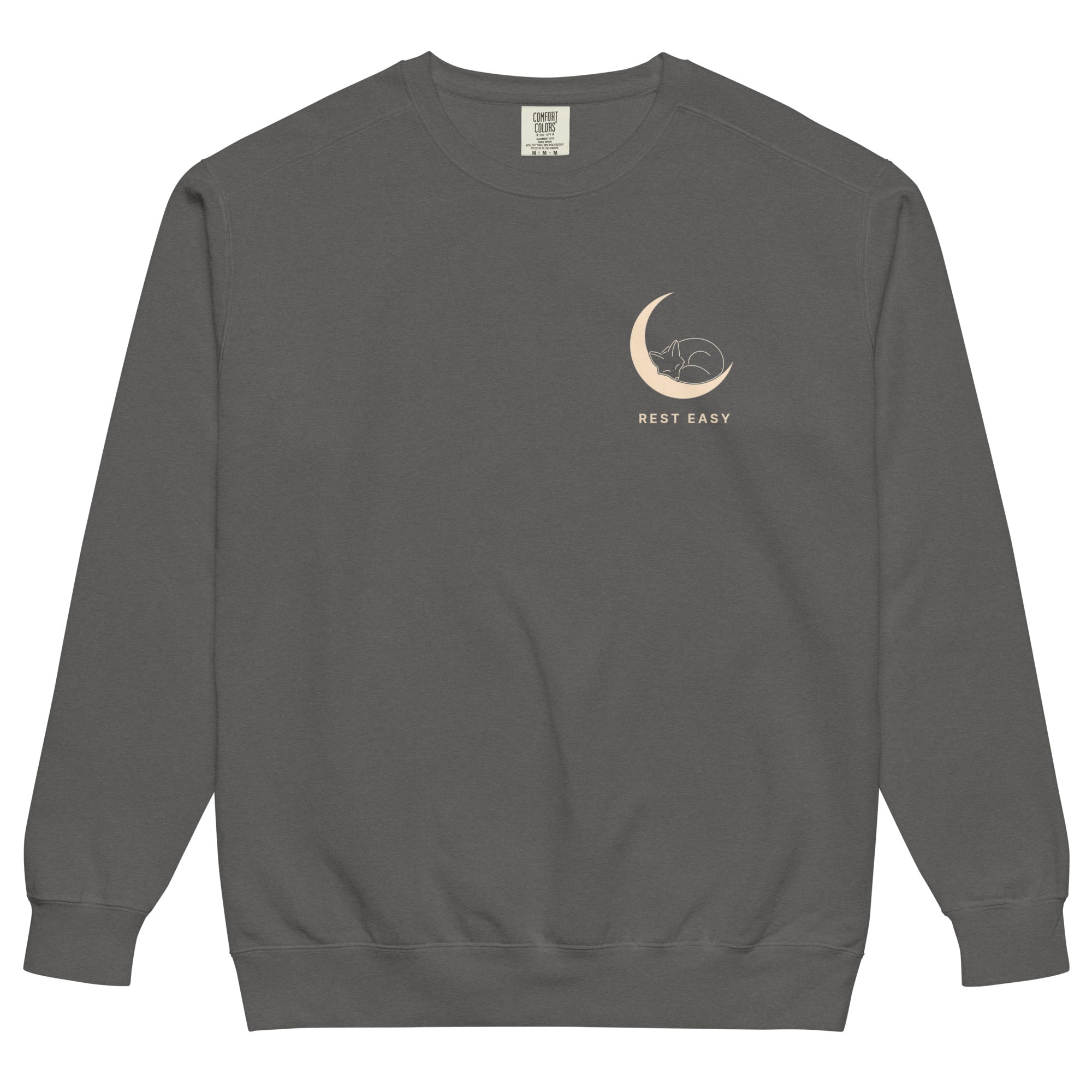 Sleepy fox in a crescent moon design on a Pepper garment-dyed sweatshirt