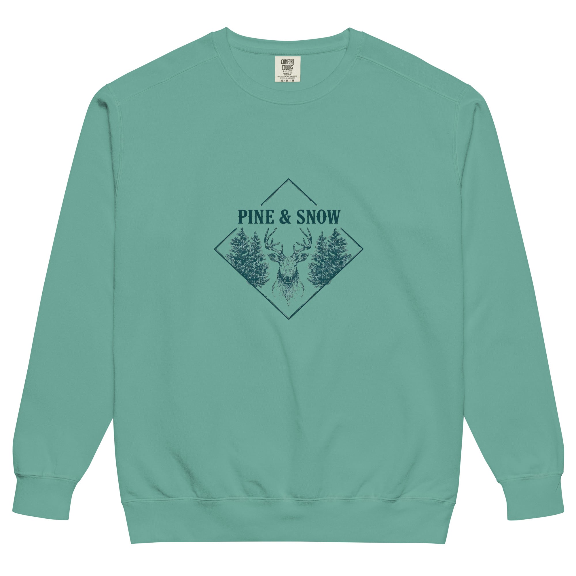 Stag emblem with pine and snow design on a Seafoam garment-dyed sweatshirt