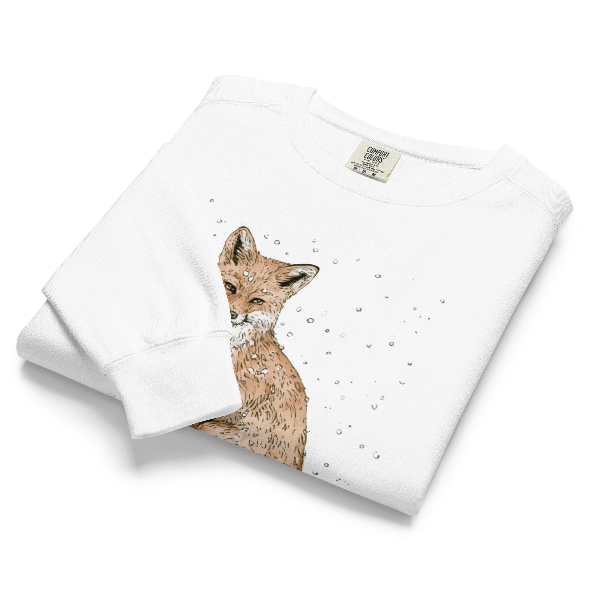 Red fox in falling snow design on a White garment-dyed sweatshirt