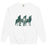 Howling wolves and moonlit forest design on a White garment-dyed sweatshirt