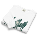 Howling wolves and moonlit forest design on a White garment-dyed sweatshirt