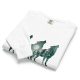 Howling wolves and moonlit forest design on a White garment-dyed sweatshirt
