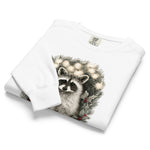 Raccoon in a Christmas wreath design on a White garment-dyed sweatshirt