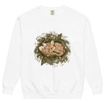 Fox asleep in a Christmas wreath design on a White garment-dyed sweatshirt