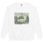 Ski gondola over pine forest design on a White garment-dyed sweatshirt