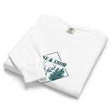 Stag emblem with pine and snow design on a White garment-dyed sweatshirt