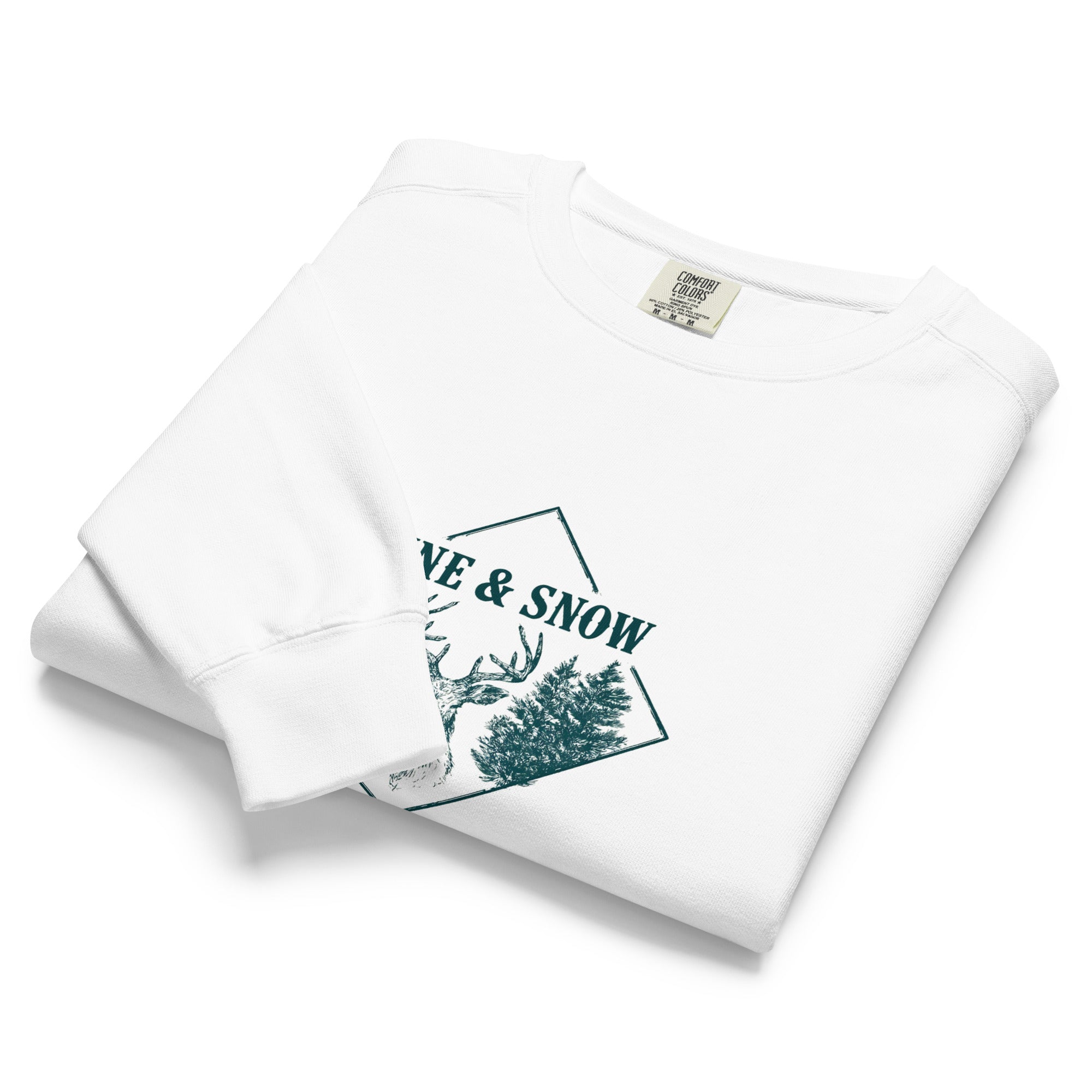 Stag emblem with pine and snow design on a White garment-dyed sweatshirt