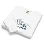 Deer and pines emblem design on a White garment-dyed sweatshirt